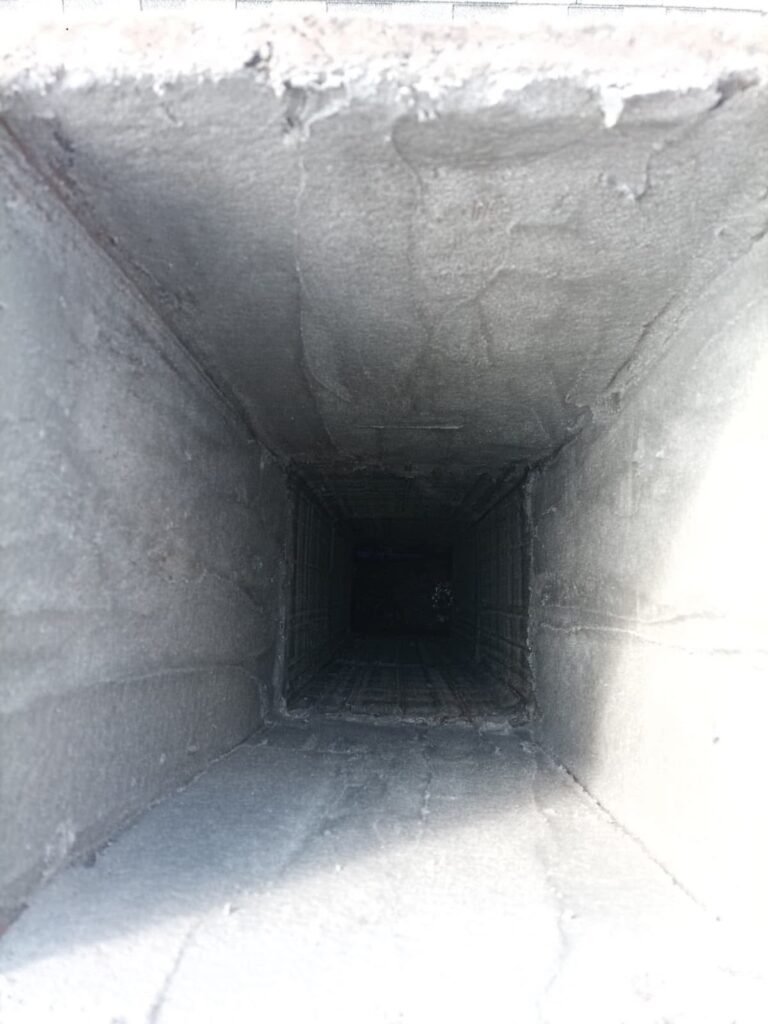 Looking up into a smooth, newly coated smoke chamber
