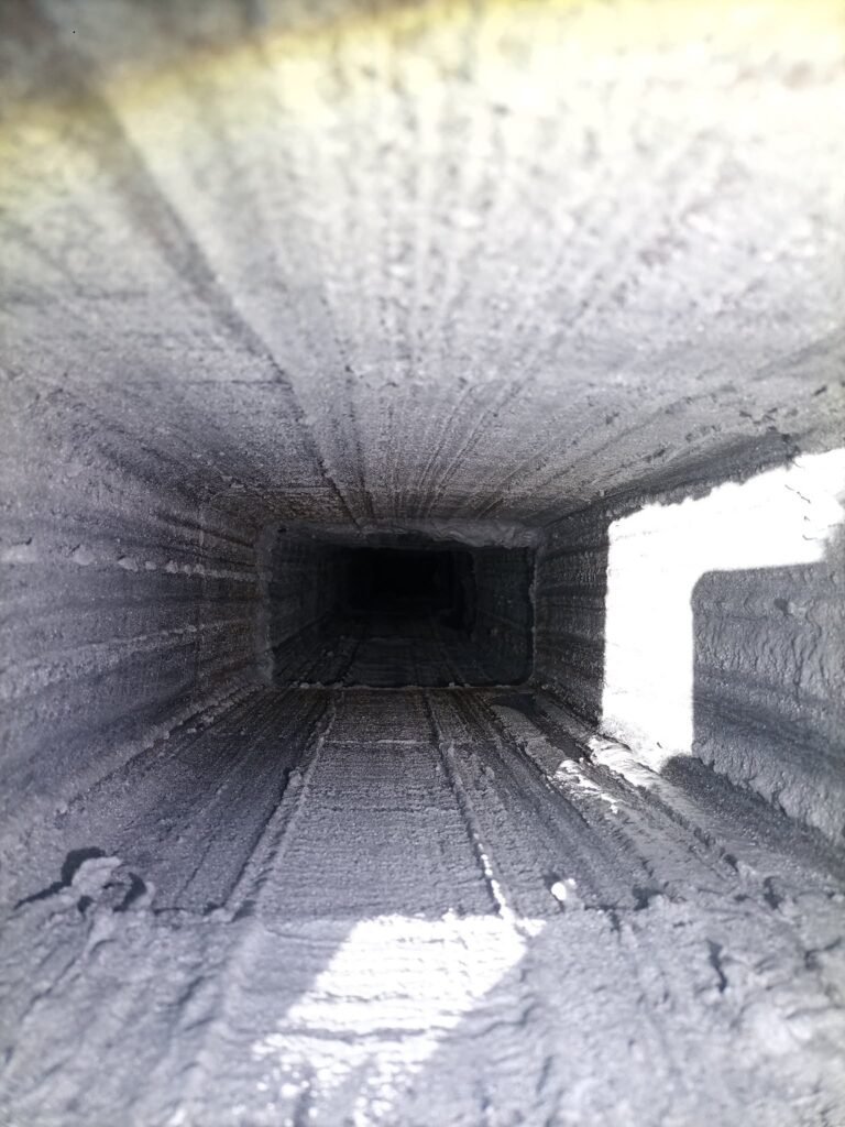 Looking up a smooth, lined flue from the fireplace end