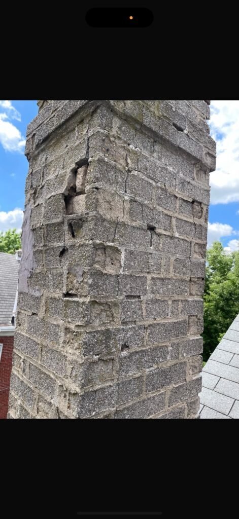 Close-up of the old chimney masonry with damaged and missing mortar